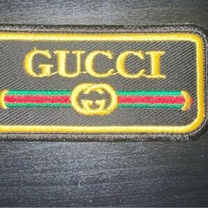 Gucci Black and Gold Logo Patch